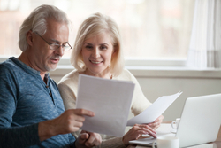 mature couple browses their finances