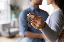 Young couple holding house keys