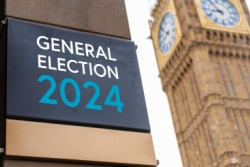 general election sign in front of the Palace of Westminster