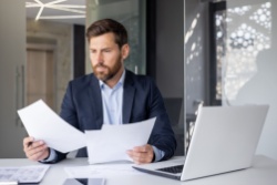 A man reviewing paperwork.