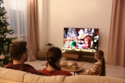 A family watching a Christmas film. 