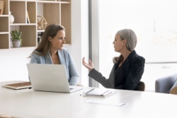 An employee having a meeting with her boss.