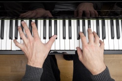 A person playing a piano. 