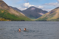 A couple wild swimming.