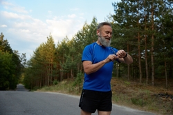 An older man out for a run.